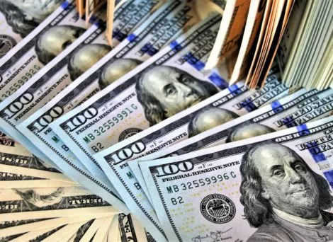 nebraska mediciaid ABA cuts illustrated by American dollar bills