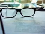 glasses on contract documents illustrates No Surprises Act article