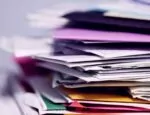 Article about digital companies preparing for new DEA rules illustrated by a pile of envelopes