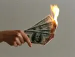 burned 100 us dollar banknotes from Unslpash by Jp Valery