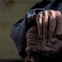 senior hands on a cane Image by Peggychoucair on Pixabay
