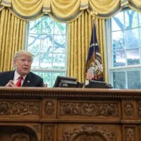 President Donald Trump at desk in the Oval Office