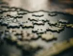 puzzle pieces illustrate article about partnership with talkspace and outcome referrals