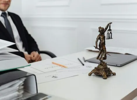 ellie mental health article illustrated by statue of lady justice